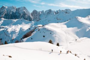 raditional houses in Vusanje with Plav and Gusinje mountain scenery in the background.