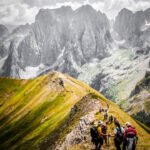 Hikers walking through the stunning Grbaja Valley in Prokletije National Park, Montenegro.