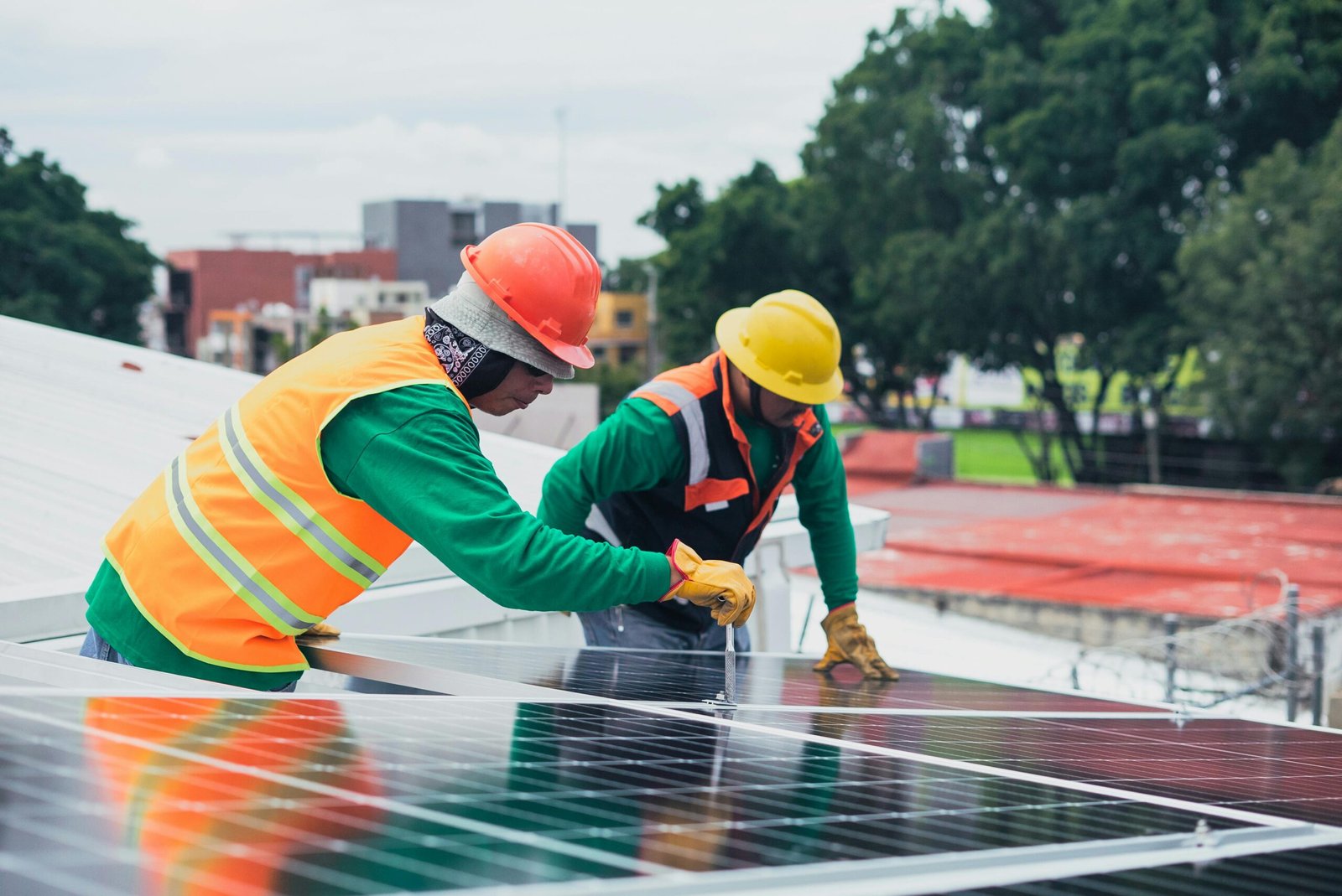 Technician installing photovoltaic solar panels on a house in Pennsylvania.
