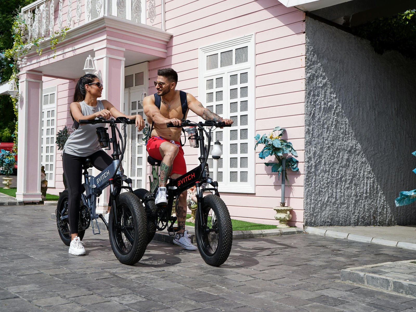Couple riding e-bikes for urban commuting and everyday electric mobility